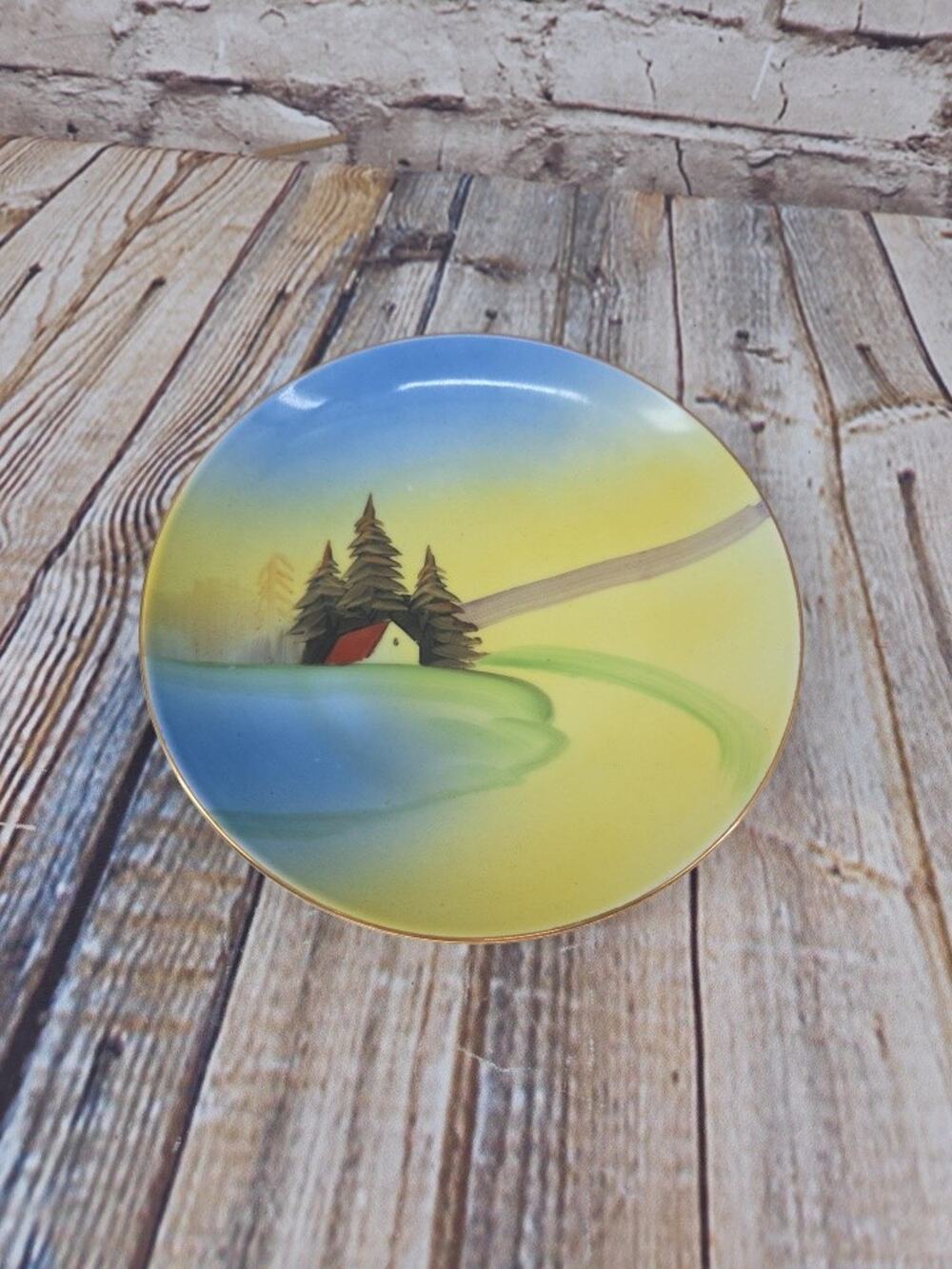 Vintage Meito China 7.5” plate hand painted Cabin River Trees made in Japan